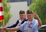 bigstock-Military-Veterans-Holding-Flag-25716107